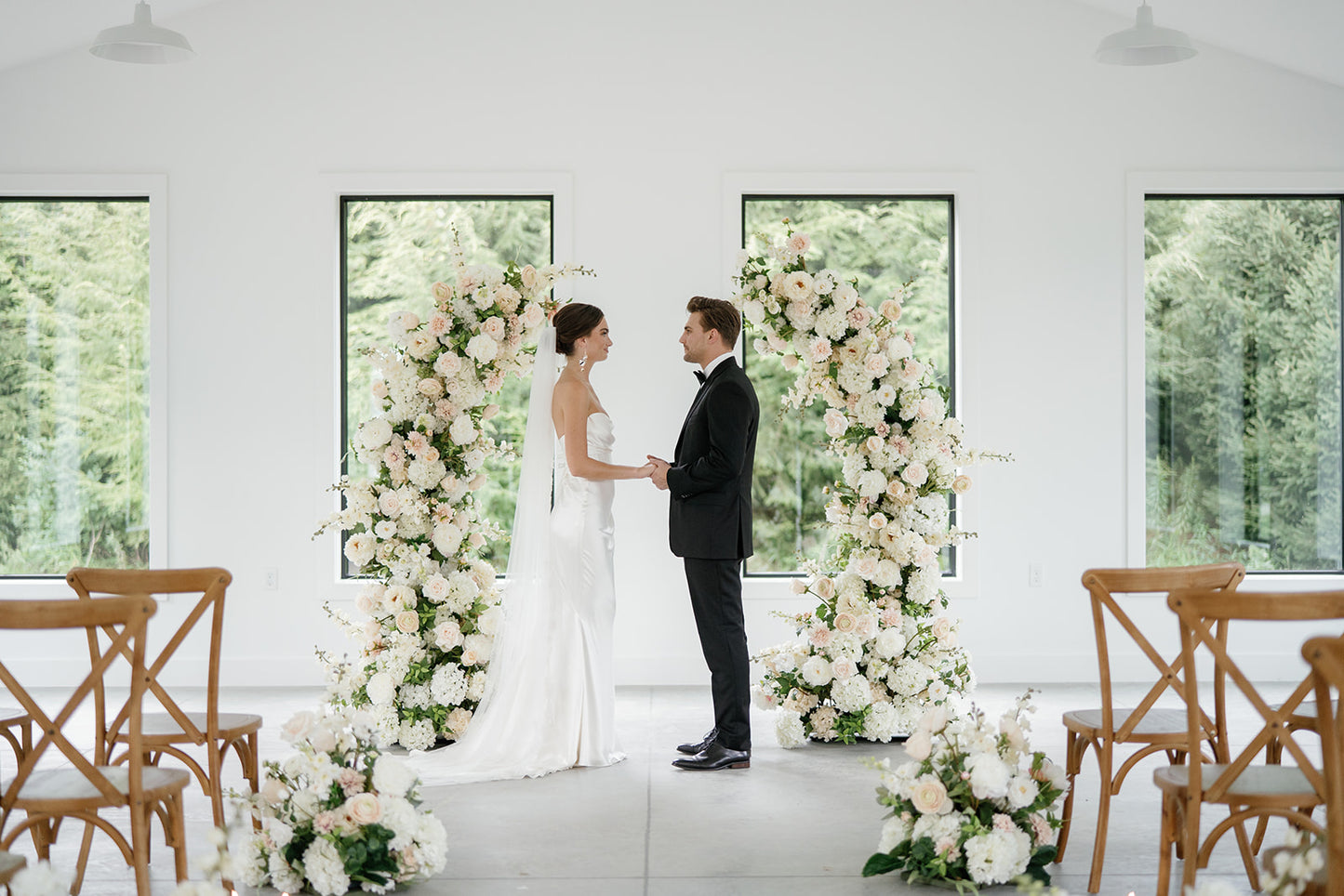 exchanging vows in front of rental flowers